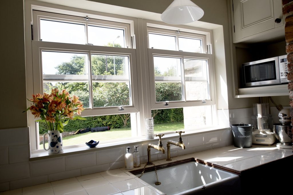 Photo from inside the kitchen showcasing how shite uPVC windows open - Glaze Windows And Doors